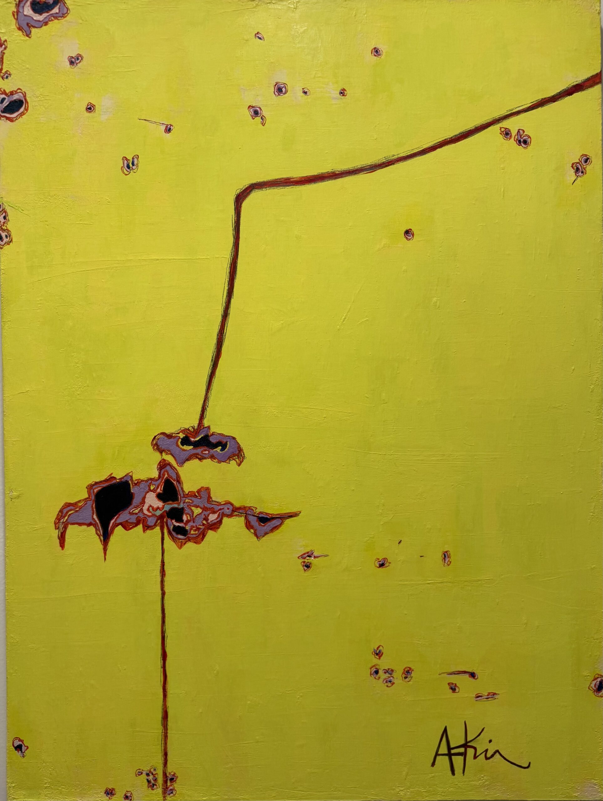 Rust spots and peeling paint on a yellow metal surface.